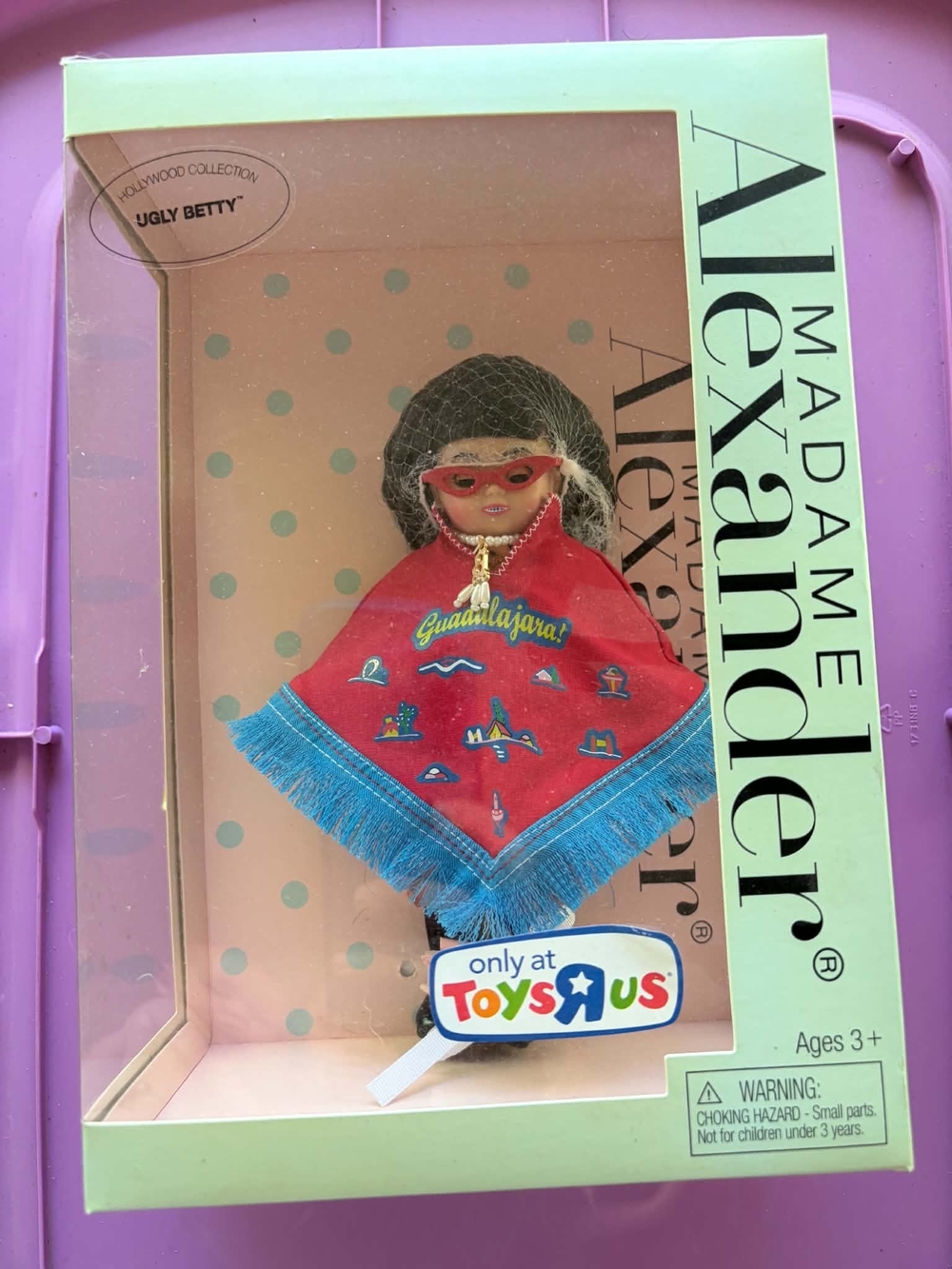 Madame Alexander Doll in Red Poncho with Blue Fringe and Red Sunglasses